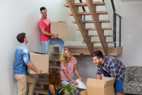 Professional movers handling a family home relocation in Lee
