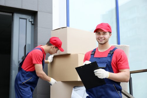 Local movers organising household items in Lee