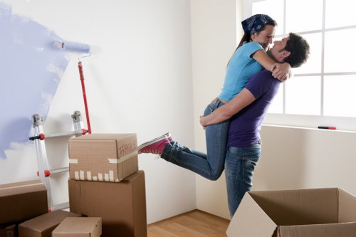Professional movers loading household furniture and boxes