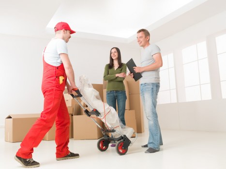 Eco-friendly moving team planning a sustainable relocation with recycled packaging