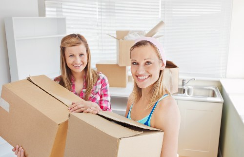 Loading furniture and boxes into a van for transport