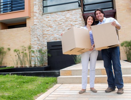 Packed boxes and furniture prepared for a home move in Lee